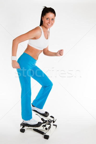 woman working out on stepper trainer Stock photo © varlyte