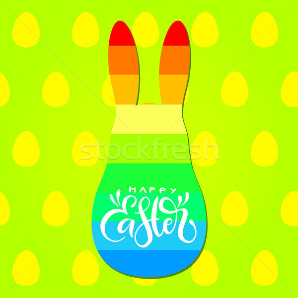 Happy Easter calligraphic inscription with rainbow bunny silhouette on green background with eggs pa Stock photo © vasilixa