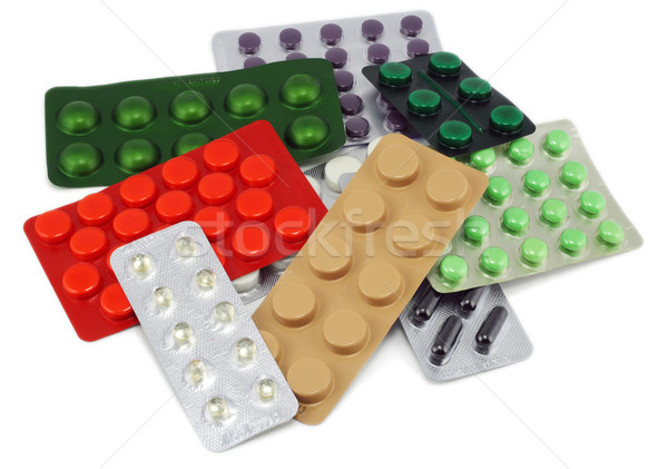 Szín halom különböző tabletták izolált fehér Stock fotó © vavlt