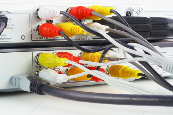 Stock photo: DVD  players with connected video and audio cables close-up