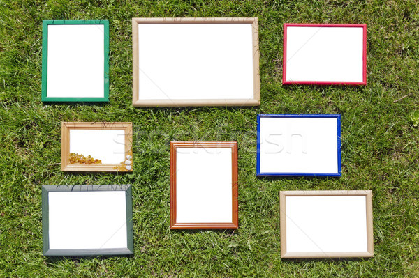 Stock photo: Wooden photo frames on spring lawn