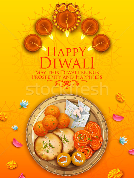 Stock photo: Burning diya with assorted sweet and snack on Happy Diwali Holiday background for light festival of 