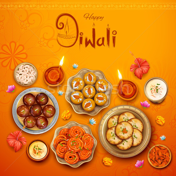 Burning diya with assorted sweet and snack on Happy Diwali Holiday background for light festival of  Stock photo © vectomart