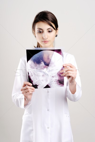 Doctor with x-ray of head Stock photo © velkol