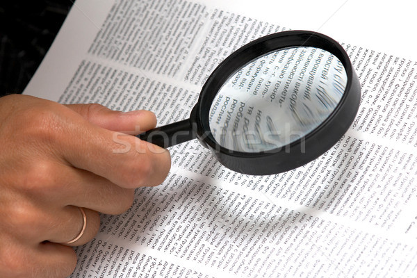 Magnifier in hand Stock photo © velkol