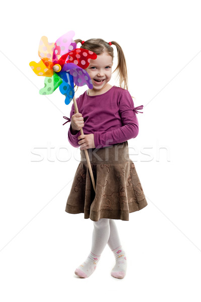 Little girl holding colorful windmill isolated Stock photo © velkol
