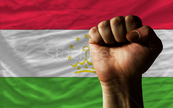 Hard fist in front of tajikistan flag symbolizing power Stock photo © vepar5