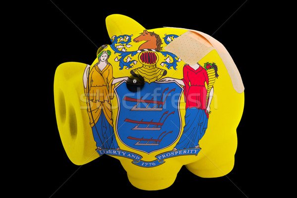 bankrupt piggy rich bank in colors of flag of american state of  Stock photo © vepar5