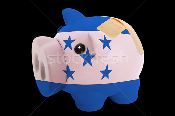 bankrupt piggy rich bank in colors of national flag of honduras  Stock photo © vepar5