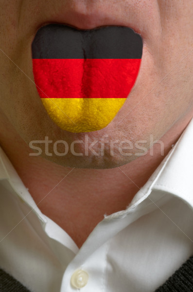 man tongue painted in germany flag symbolizing to knowledge to s Stock photo © vepar5