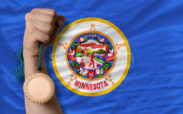 Stock photo: Bronze medal for sport and  flag of american state of minnesota 