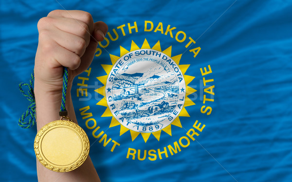 Stock photo: Gold medal for sport and  national flag of south dakota   