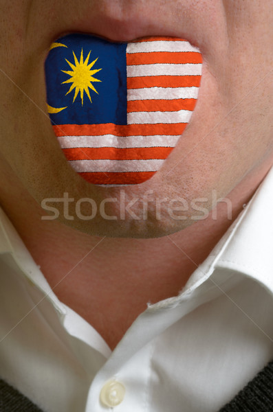man tongue painted in malaysia flag symbolizing to knowledge to  Stock photo © vepar5