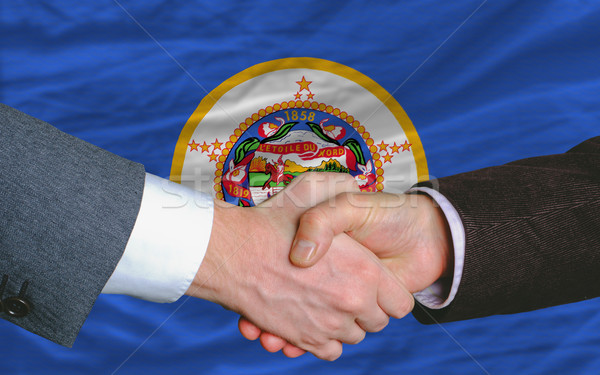 in front of american state flag of minnesota two businessmen han Stock photo © vepar5