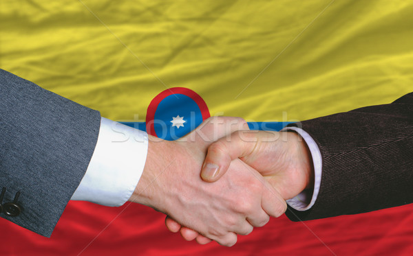 businessmen handshakeafter good deal in front of columbia flag Stock photo © vepar5