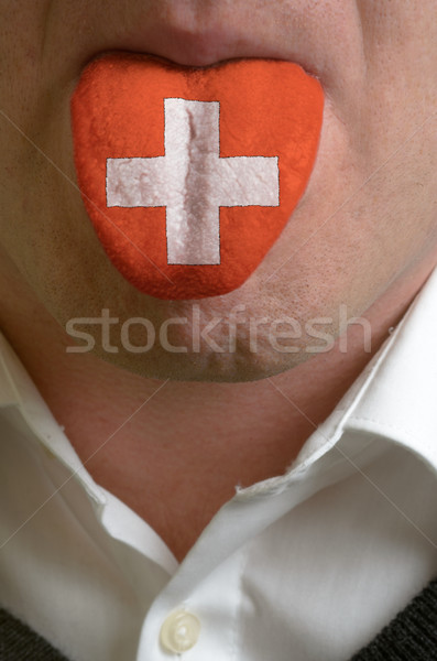 man tongue painted in switzerland flag symbolizing to knowledge  Stock photo © vepar5