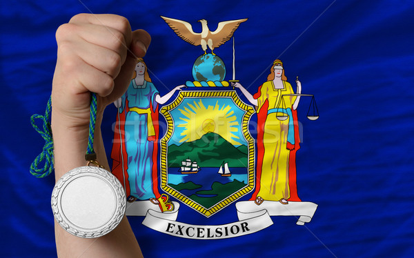 Stock photo: Silver medal for sport and  flag of american state of new york  