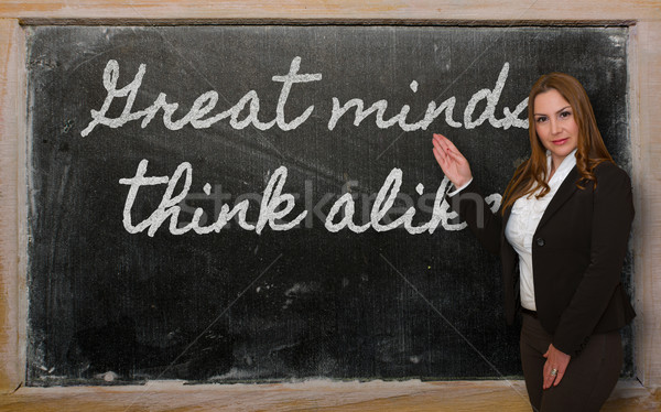 Teacher showing Great minds think alike on blackboard Stock photo © vepar5