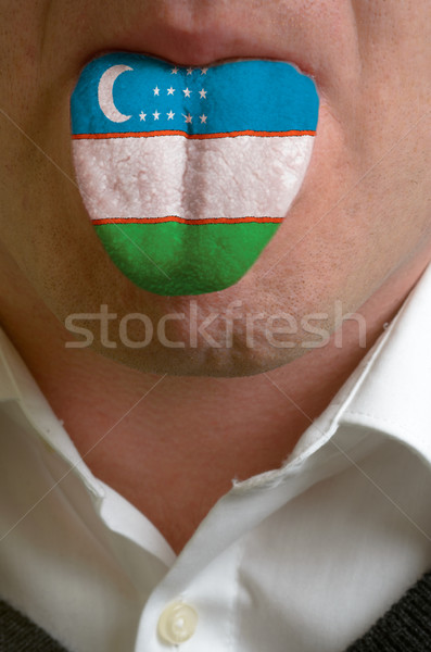 man tongue painted in uzbekistan flag symbolizing to knowledge t Stock photo © vepar5