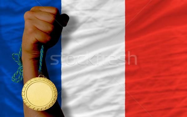 Goldmedaille Sport Flagge Frankreich Gewinner halten Stock foto © vepar5
