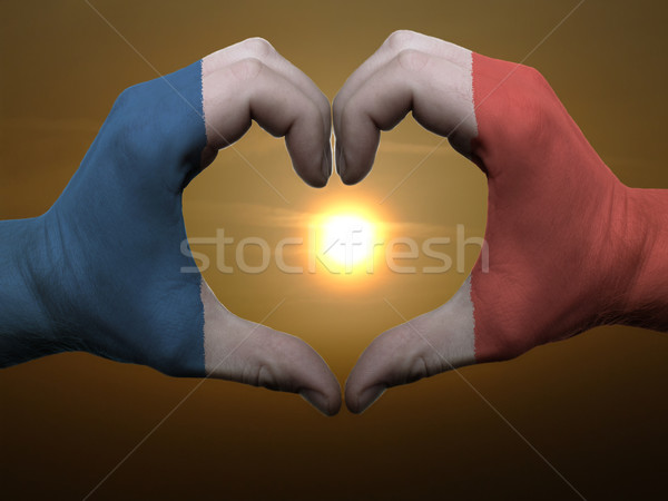 Heart and love gesture by hands colored in france flag during be Stock photo © vepar5