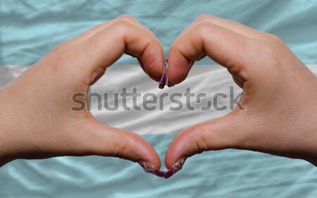 over flag of djibuti showed heart and love gesture made by hands Stock photo © vepar5