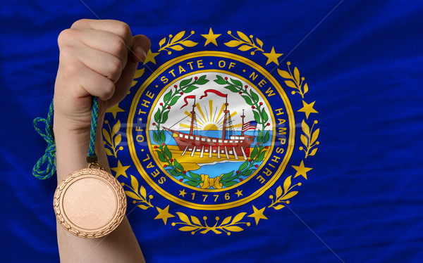 Bronze medal for sport and  flag of american state of new hampsh Stock photo © vepar5