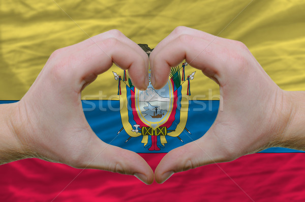 Heart and love gesture showed by hands over flag of ecuador back Stock photo © vepar5