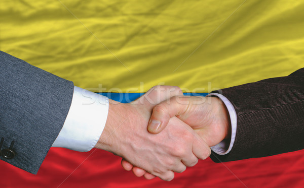 businessmen handshakeafter good deal in front of columbia flag Stock photo © vepar5