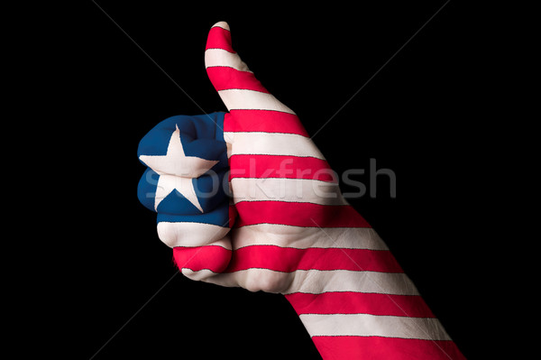 Stock photo: liberia national flag thumb up gesture for excellence and achiev