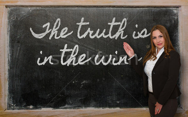Teacher showing The truth is in the wine on blackboard Stock photo © vepar5
