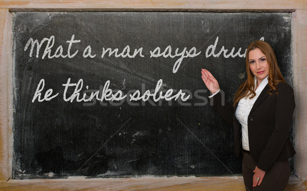 Teacher showing What a man says drunk, he thinks sober on blackb Stock photo © vepar5