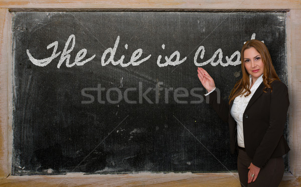 Teacher showing The die is cast on blackboard Stock photo © vepar5