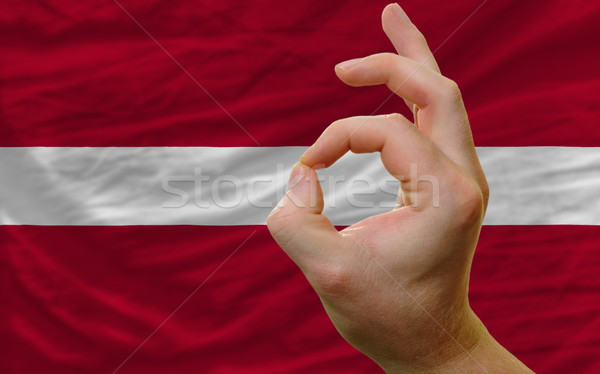 ok gesture in front of latvia national flag Stock photo © vepar5