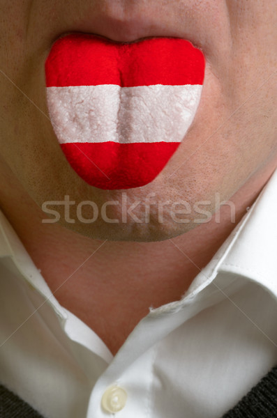 man tongue painted in austria flag symbolizing to knowledge to s Stock photo © vepar5