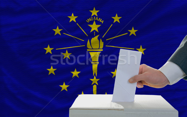 man voting on elections in front of flag US state flag of indian Stock photo © vepar5