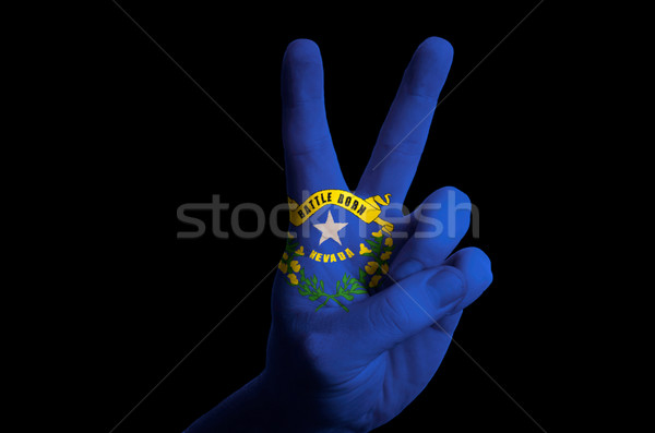 nevada us state flag two finger up gesture for victory and winne Stock photo © vepar5