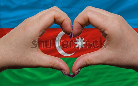 Heart and love gesture showed by hands over flag of tunisia back Stock photo © vepar5
