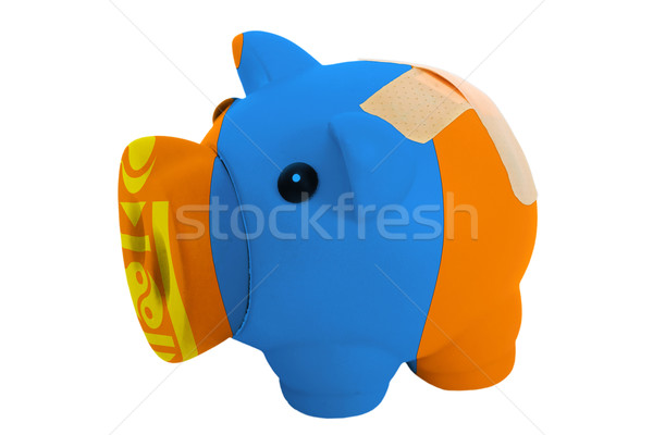 closed piggy rich bank with bandage in colors national flag of m Stock photo © vepar5