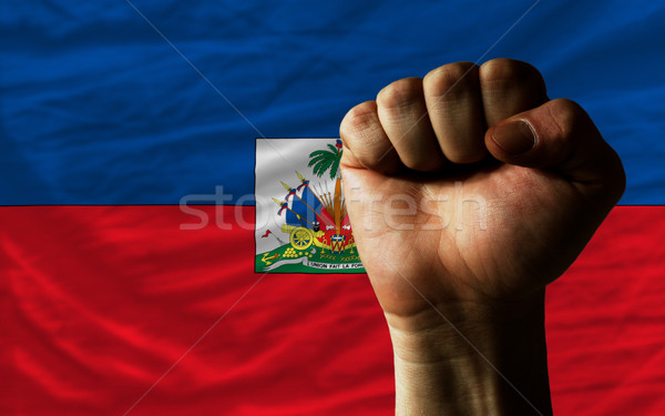 Hard fist in front of haiti flag symbolizing power Stock photo © vepar5