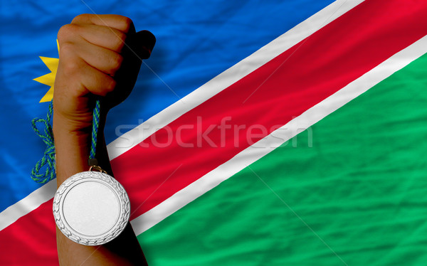 Silber Medaille Sport Flagge Namibia halten Stock foto © vepar5