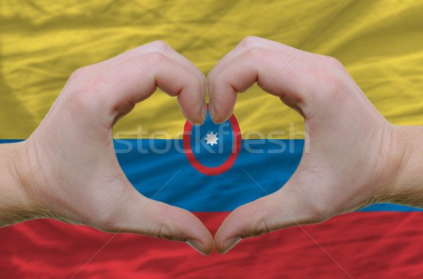 Heart and love gesture showed by hands over flag of columbia bac Stock photo © vepar5