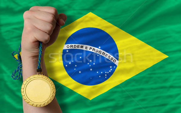 Goldmedaille Sport Flagge Brasilien Gewinner halten Stock foto © vepar5