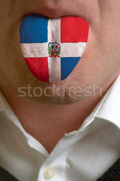man tongue painted in dominica flag symbolizing to knowledge to  Stock photo © vepar5