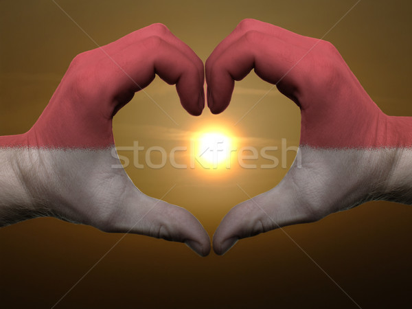Heart and love gesture by hands colored in indonesia flag during Stock photo © vepar5