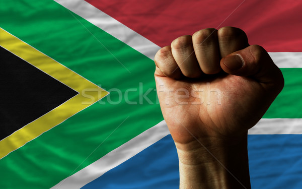 Hard fist in front of south africa flag symbolizing power Stock photo © vepar5