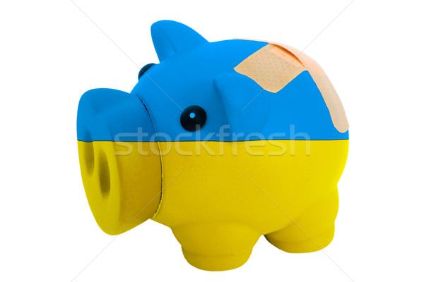 closed piggy rich bank with bandage in colors national flag of u Stock photo © vepar5