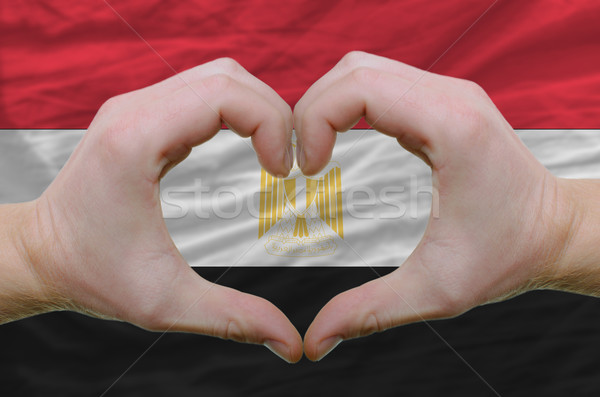 Heart and love gesture showed by hands over flag of egypt backgr Stock photo © vepar5