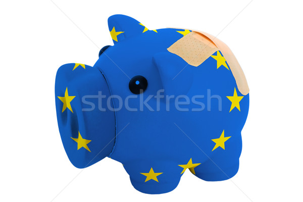 closed piggy rich bank with bandage in colors national flag of e Stock photo © vepar5