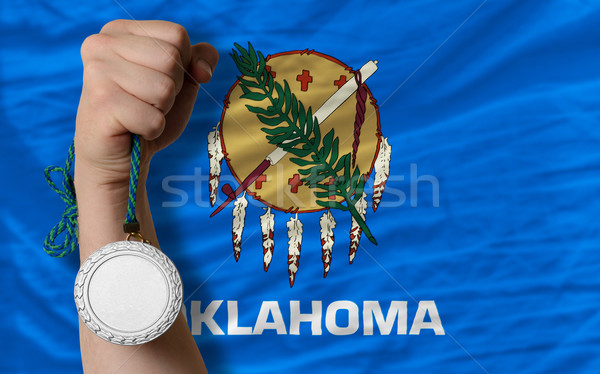 Stock photo: Silver medal for sport and  flag of american state of oklahoma  